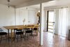 Modern home with Kitchen, Ceramic Tile Floor, and Pendant Lighting. eat-in kitchen; drapery fashioned of queen-size percale sheets, custom copper tube rod Photo 9 of PILGRIM HOUSE