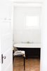 Modern home with Bath Room, Freestanding Tub, Ceramic Tile Floor, and Porcelain Tile Wall. Footed tub, the base of which is painted Railings by Farrow & Ball; Smedbo Air towel hooks in foreground Photo 14 of PILGRIM HOUSE