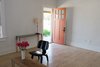 Modern home with Living Room, Chair, Console Tables, Table Lighting, and Light Hardwood Floor. entry in living room; Blu Dot by Target console; heirloom copper and wrought-iron lamp Photo 15 of PILGRIM HOUSE