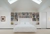 Modern home with Bedroom, Bed, Storage, Bookcase, Shelves, Night Stands, Track Lighting, Pendant Lighting, and Carpet Floor. Master bedroom daytime Photo 10 of House in the Woods