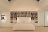 Modern home with Bedroom, Bed, Bookcase, Shelves, Storage, Night Stands, Track Lighting, Wall Lighting, and Carpet Floor. Master bedroom night Photo 11 of House in the Woods