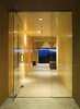 Modern home with Living Room, Ceiling Lighting, and Concrete Floor. The entry to the home includes a grand glass entrance with a stunning view of the Jemez Mountains. Photo 12 of Santa Fe Contemporary