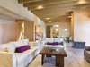 Modern home with Living Room, Sofa, End Tables, Coffee Tables, Pendant Lighting, Concrete Floor, Ceiling Lighting, Recessed Lighting, and Wood Burning Fireplace. The living room and dining room are separated by a pumpkin cutting wall and fireplace with hand troweled beeswax walls and scored concrete floors Photo 10 of Santa Fe Contemporary