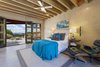 Modern home with Bedroom, Bed, Night Stands, Chair, Ceiling Lighting, Recessed Lighting, and Concrete Floor. The oversized master bedroom includes a private courtyard and impressive Jemez Mountain and sunset views. Photo 7 of Santa Fe Contemporary