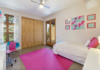 Modern home with Kids Room, Bed, Chair, Concrete Floor, Rockers, Pre-Teen Age, and Girl Gender. The generous sized guest rooms share a bathroom and offer impressive views of the High Desert. Photo 2 of Santa Fe Contemporary
