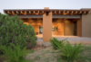 Modern home with Outdoor, Shrubs, Back Yard, Desert, Trees, Hardscapes, Concrete Patio, Porch, Deck, and Boulders. The backyard includes an ironwork feature which catches the rainwater from the roof to create a waterfall. Photo 4 of Santa Fe Contemporary