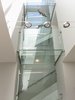 Modern home with Staircase, Wood Railing, and Wood Tread. Glass enclosed staircase with glass bridges on each floor Photo 4 of Modern Building Approved in Jackson Ward-Historic district
