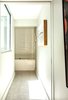 Window on left brings natural light into view of master tub Photo 16 of Modern Building Approved in Jackson Ward-Historic district modern home