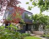 Modern home with Outdoor, Front Yard, Trees, Grass, Shrubs, and Walkways. The entryway of the Pink House is recessed to enhance the spatial notion of solid and void. Photo 2 of Pink House