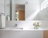 Modern home with Bath Room, Engineered Quartz Counter, Wall Lighting, and Undermount Sink. Bathroom palette blends seamlessly into the whole floor plan with white oak accents and decorative lighting. Photo 9 of Pink House