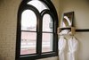 Modern home with Bedroom, Storage, and Shelves. The orginal dark wood window frames and exterior brick walls remain in tact. Simple, modern additions provide amenities in the guest rooms. Photo 9 of The Society Hotel