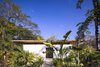 Modern home with Outdoor, Gardens, Trees, Flowers, and Front Yard. Each villa sits harmoniously within the tropical landscape, shaded by trees and vegetation. Photo 3 of Nalu Nosara