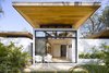 Modern home with Outdoor, Small Patio, Porch, Deck, Gardens, and Shrubs. The underside of the overhanging roof represents the area's local craftsmanship. Photo of Nalu Nosara
