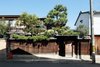 Modern home with Outdoor, Wood Fences, Wall, Trees, Front Yard, and Vertical Fences, Wall. A private entry allows guests to rest and explore as they please. Photo 2 of Nichinichi Townhouse