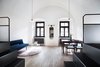 Modern home with Dining Room, Pendant Lighting, Chair, Table, and Medium Hardwood Floor. The 4 Dorm is a spacious apartment style dorm set up with two beds up top, and two beds below, in addition to a private living area. Photo 8 of Long Story Short Hostel