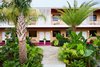 Modern home with Exterior, Brick Siding Material, and Flat RoofLine. The Drifter is the first hotel by trio Jayson Seidman, Zach Kupperman, and Alex Ramirez, who are pushing the concept of a hotel brand that focuses on building dynamic, culturally-enhanced experiences for modern-day drifters. In addition to revamping the finishes and building a complete package of curated accessories, the redesign created spaces for cultural programming, such as art shows and live music. A tropical courtyard and pool, adorned with a cantilevered disco ball, provides a contemporary setting for such programs. A hotel bar, which is accessible from both the pool side courtyard and interior lobby bar, offers a diverse array of cocktails inspired by the eclectic decor. Photo 2 of The Drifter Hotel