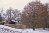 Modern home with Exterior, House, Mid-Century Building Type, and Concrete Siding Material. A curved concrete block wall conceals one of the three exterior terraces. Low-slung roofs appear to hover above the landscape. Photo 2 of Frank Lloyd Wright's Eppstein House