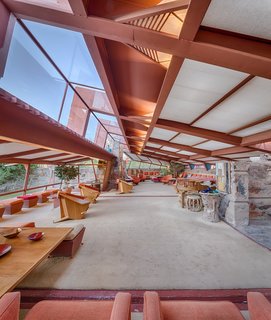 Roof overhangs allow light to fall in, but protect interior spaces from unwanted sunlight.  The redwood structure remains exposed on the interior, creating a seamless exterior to interior connection. 