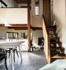 Modern home with Dining Room, Chair, Table, and Concrete Floor. Three levels intermix within the small footprint of the home, creating a loft-like feeling. Photo 3 of MiniMod Cabin