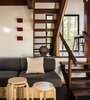 Modern home with Staircase, Wood Tread, and Wood Railing. Open wood stairs allow light to pass between levels. Photo 2 of MiniMod Cabin