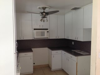 The existing kitchen was cramped, dark, and outdated. The '80s finishes and small floor plate needed to be updated in order for the space to be functional.