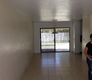 Before, the dining room was closed off from the kitchen. The existing sliding glass doors were filled in to make way for a larger laundry space.