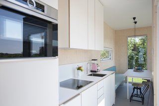 A fully equipped kitchen provides all the needed amenities for a luxurious cabin retreat.