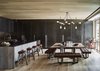 Modern home with Dining Room, Table, Stools, Light Hardwood Floor, Ceiling Lighting, and Bench. The various tones of wood echo the birch, pine, and silver maple forests of the surrounding vistas. Photo 4 of Caldera House