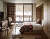Modern home with Bedroom, Light Hardwood Floor, Bed, Chair, Floor Lighting, Rug Floor, and Bench. Prints, plaids, and furs provide warmth and coziness, while introducing nods to he rugged American West. Photo 12 of Caldera House