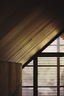 The continual use of wood creates warmly lit interiors that accentuate the simple, gabled formwork.