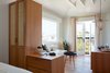 Modern home with Living Room, Media Cabinet, Medium Hardwood Floor, Accent Lighting, Pendant Lighting, Storage, End Tables, Lamps, Bench, and Floor Lighting. A Juliette balcony with double French doors allows the ocean breezes to fill this stylish retreat, which has high, vaulted ceilings. Photo 7 of Hotel Joaquin