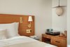 Modern home with Bedroom, Night Stands, Bed, Dresser, Pendant Lighting, Accent Lighting, and Wall Lighting. Instead of televisions, rooms are outfitted with vinyl record players and a curated music collection. Photo 5 of Hotel Joaquin