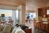 Modern home with Chair, Stools, Accent Lighting, Terra-cotta Tile Floor, Shelves, Storage, and Lamps. Inspired by its own backyard, Saline is a culinary delight with a sea-focused menu and modern Mediterranean decor. Photo 14 of Hotel Joaquin