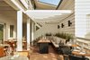 Modern home with Chair, Wall Lighting, Bench, Terra-cotta Tile Floor, and Accent Lighting. Dine well with fellow travelers beneath the stars and lights. Photo 15 of Hotel Joaquin