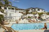 Modern home with Outdoor, Trees, Metal Fences, Wall, Hanging Lighting, and Shrubs. Guests can gather by the pool, which overlooks the ocean. Drink and food service is available. Photo 12 of Hotel Joaquin