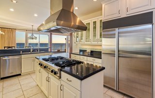 The recently updated kitchen includes top-of-the-line appliances and finishes. 