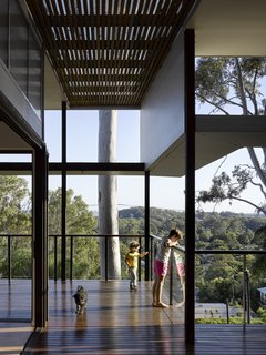 The home's living spaces are up in the tree tops surrounded by lush foliage.