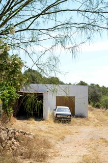 Before: The workshop and storage warehouse was left in disrepair. Only the exterior walls and a portion of the roof were salvageable.
