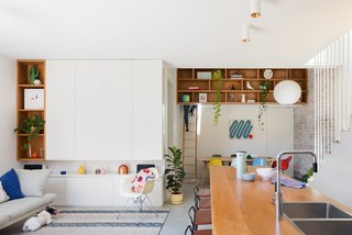 What was once a poorly planned floor plan has transformed into open, brightly lit living spaces at the hub of the home.