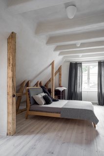 In the master bedroom and elsewhere on the first floor, the ceiling joists are covered with clay plaster, all painted to match the adjacent surfaces.