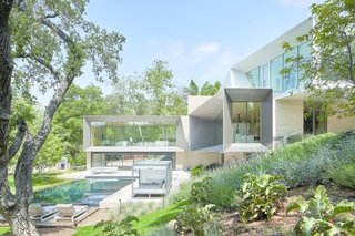 The grounds contain large, open areas for gathering and entertaining, surrounded by a grove of live oak trees for privacy and seclusion.