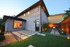 Modern home with Outdoor, Back Yard, Hardscapes, Grass, Small Patio, Porch, Deck, Wood Fences, Wall, Landscape Lighting, and Wood Patio, Porch, Deck. Fish eye Photo of White House