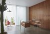 Modern home with Office, Study Room Type, Chair, Desk, Concrete Floor, Lamps, and Storage. In 2015 the Fabricius & Kastholm desk bo-555 was manufactured for the Santa Monica Residence. Before that, it hadn't been manufactured for more than two decades. Photo 6 of Santa Monica Residence