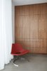 Modern home with Office, Study Room Type, Chair, Concrete Floor, and Storage. In 2015, the owner of Bo-Ex in Denmark, made the last Scimitar Chair before closing his factory in 2016. The chair is hand made at the original factory in Denmark with the original tools of the 1960's. To preserve the authenticity and high quality the leather has been shipped from Denmark to Italy where an authentic sewing machine was located to stitch the leather before shipping it back to Denmark to finalize the chair. The name of this rare chair is derived from the Turkish sword. Photo 7 of Santa Monica Residence
