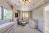Modern home with Bedroom, Ceiling Lighting, Rockers, Bed, Dresser, and Carpet Floor. Nursery Photo of The Ryan House