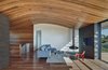 Modern home with Living Room, Chair, Recessed Lighting, Medium Hardwood Floor, Corner Fireplace, Coffee Tables, Sectional, Hanging Fireplace, and Rug Floor. Living area Photo 5 of Skyline House