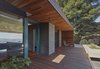 Modern home with Outdoor, Front Yard, Grass, Shrubs, Hardscapes, Small Patio, Porch, Deck, Wood Patio, Porch, Deck, Metal Fences, Wall, and Landscape Lighting. Entry porch Photo 6 of Skyline House