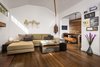 Modern home with Bench, Sectional, Coffee Tables, Pendant Lighting, Sofa, Medium Hardwood Floor, Metal, Awning Window Type, Dining Room, Chair, and Table. Living Room with Dining Room beyond. Clerestory windows allow for more natural light Photo 3 of Boise Residence