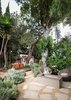 Modern home with Garden, Trees, Shrubs, Hardscapes, Walkways, and Pavers Patio, Porch, Deck. Firepit and wire fox terrier with hardscape and landscape to exterior dining terrace at raised deck beyond Photo 18 of Boise Residence