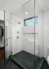 Modern home with Engineered Quartz Counter, Recessed Lighting, Undermount Sink, Enclosed Shower, Subway Tile Wall, Two Piece Toilet, Windows, Awning Window Type, and Metal. Shower with clerestory window for privacy at bathroom adjacent to walk-in closet Photo 13 of Allaseba Residence